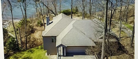 arial view overlooking house and Lake Michigan