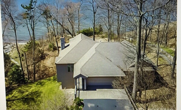 arial view overlooking house and Lake Michigan