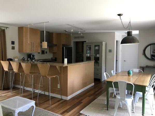 Modern Kitchen, with counter seating, and dining table