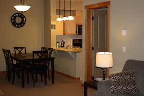 Dining area and kitchen as seen from living room.