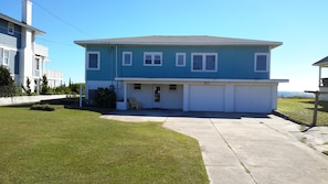 Street view of house, directly on the ocean