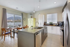 Modern kitchen-Keurig with K pods-sugar-creamers-hot pot for tea & hot chocolate