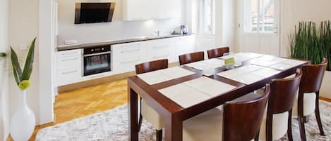 Dining room with fully equipped kitchen