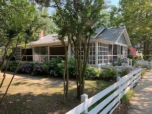 The Oak Cottage's Screened in Porch wraps around two sides of the cottage.