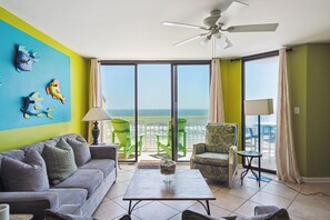 Enjoy the beach front living room, with plenty of seating.