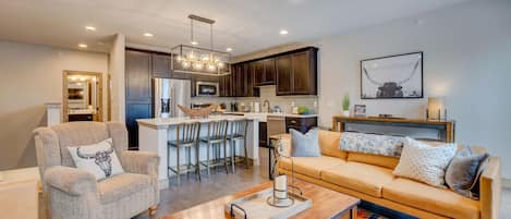 Expansive open floor plan of this mountain chalet in Winter Park, with view of living area and kitchen.