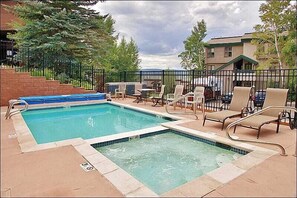 Heated Pool & Hot Tub with the condo in the background