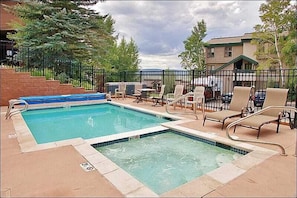 Heated Pool & Hot Tub with the condo in the background