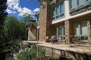 Lower Patio with Outdoor Fireplace & Gardens