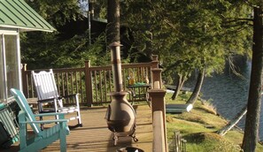 Enjoy the tranquility of the lake on the wraparound porch.
