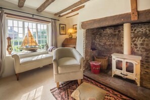 Brooke Cottage, Great Walsingham: Sitting room with wood burning stove