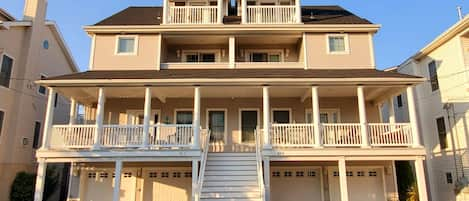 steps from the beach, large gated porch, extra large garages and ample parking