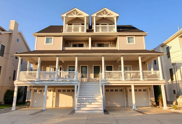 steps from the beach, large gated porch, extra large garages and ample parking