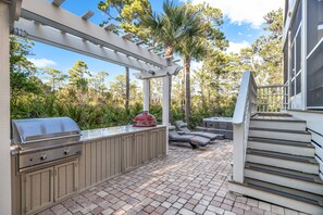 Back patio, outdoor kitchen, and private hot tub