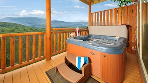 Basement level hot tub w/a view (located just outside the pool room).