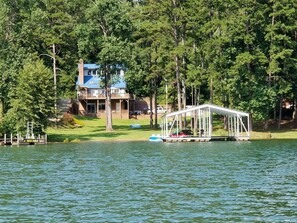 Level lot with dock that includes 1 covered slip and 2 jet ski ports