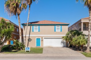 Classic Spanish style home with large driveway and garage