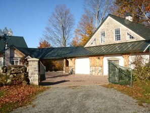 Front of secluded rental with carport.