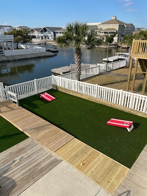 Artificial turf added to back yard for a resort like playground.  NO SAND SPURS!