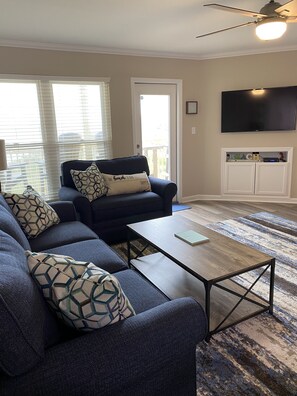 Den has a sofa and two chair-and-a-half sleeper sofas.  