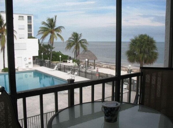 Balcony view of pool and ocean