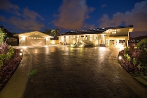 Large custom driveway and garage has space for 6-8 vehicles.