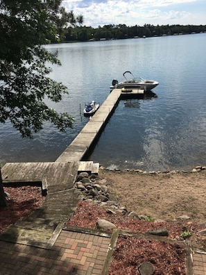 Steps down to dock, dock, and portion of the sand beach 