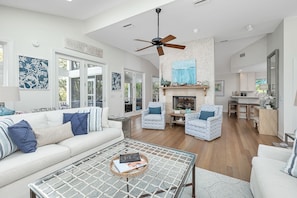 A double-sided fireplace separates the Living Area from the Dining Area.