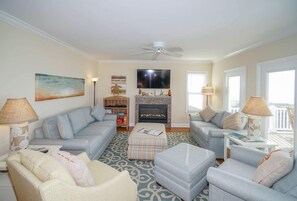 Oceanfront family room with gas fireplace.