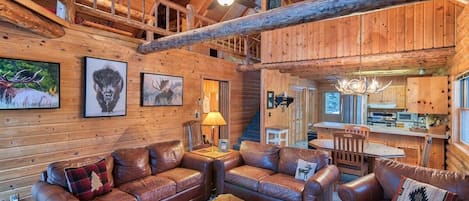 You'll love the rustic feel of the living area, which features vaulted ceilings, beautiful exposed beams, and comfortable furniture.