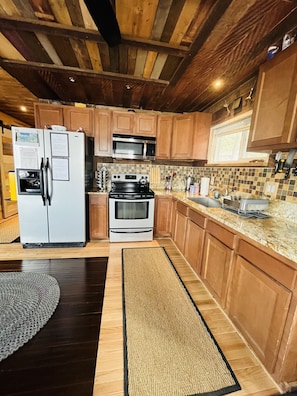 Full kitchen. Refrigerator, freezer, microwave, toaster, coffee maker