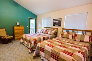 Two queen beds in the large loft bedroom.