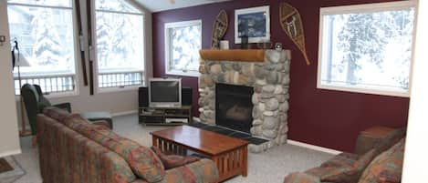 Main living room is relaxing with a gas fireplace, seating, cable TV, WIFI.