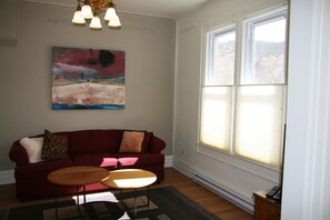 One of 2 front parlors with new, comfortable convertible sofa 