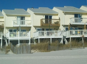 Two story Townhome walk off deck thru sea oats and palm trees