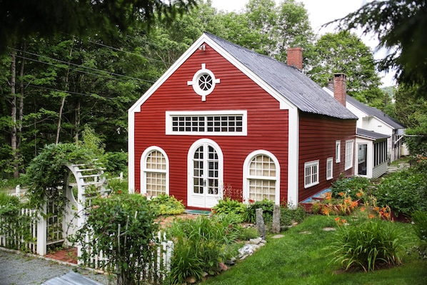 Front of house with antique french church doors