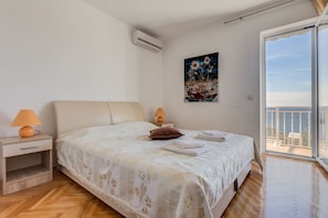 Comfortable Double Bed in Bedroom with Sea View.