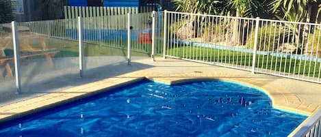 Pool, fully fenced and with pool cover to help keep it clean and warm.