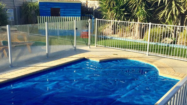 Pool, fully fenced and with pool cover to help keep it clean and warm.