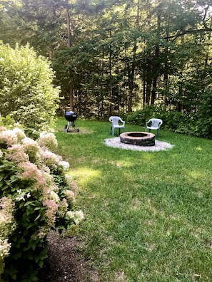 Weber Charcoal grill (Spring through Fall Only) & Masonry fire pit.