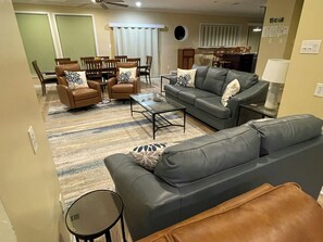 Open living area with living room, game room, dining and kitchen