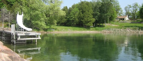 view from the point of the dock beach and house