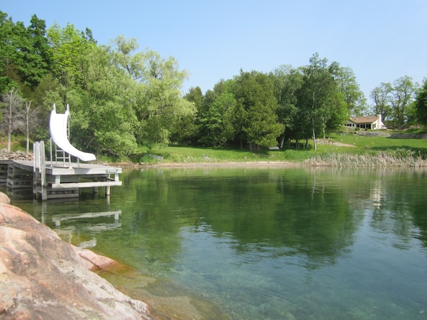 view from the point of the dock beach and house