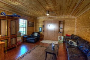 Bunkhouse photo looking towards the Murphy bed against the wall.