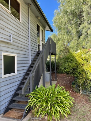 Rear access stairs to property