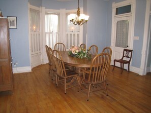 Large table easily seats 10 in the Dining Room - with 2 leaves and chairs for 12