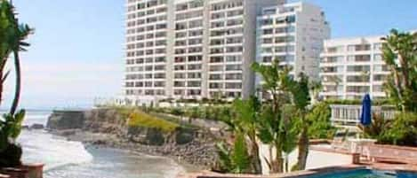 Condo complex. Unit is second building from left above palm trees