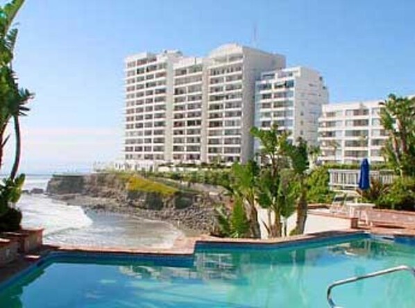 Condo complex. Unit is second building from left above palm trees