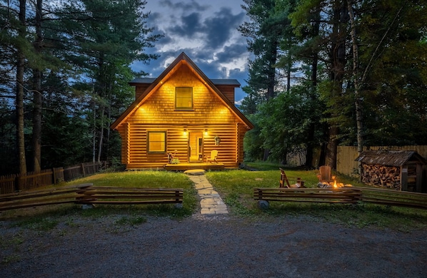 Wilmington Range Chalet twilight from driveway with campfire