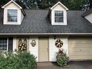 Middle door is to upstairs main living space; Left door to optional office/BR2.